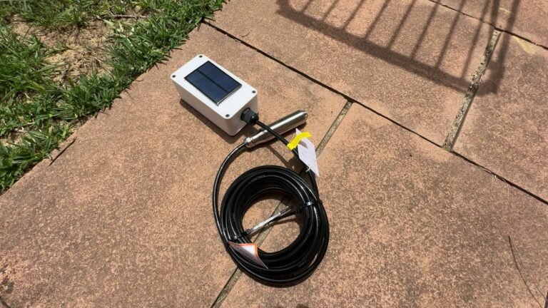 Water tank pressure sensor sitting on pavers