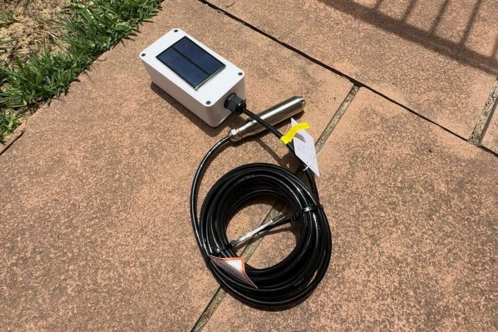 Water tank pressure sensor sitting on pavers